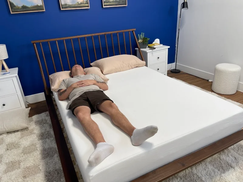 A person back-sleeping on a Polysleep Sierra Mattress