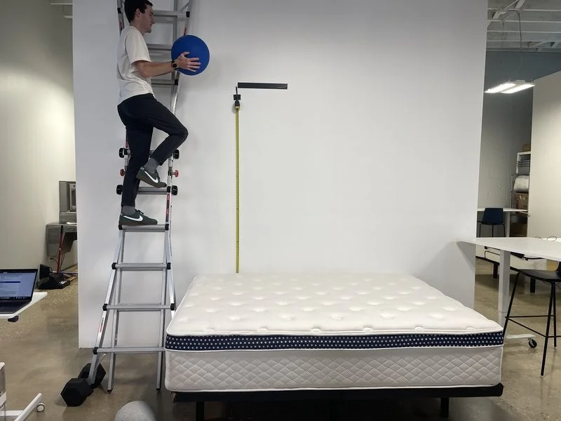 A mattress tester dropping a weighted ball to measure the bounce of the WinkBed Plus.
