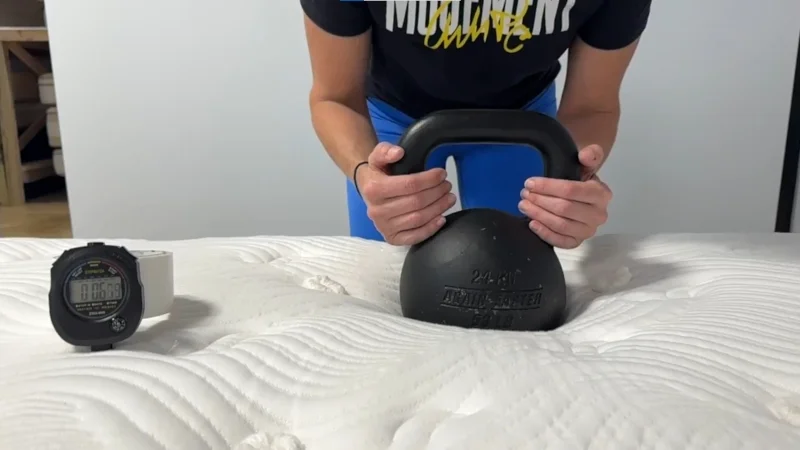 Our tester performing a response test on a Big Fig Classic Mattress