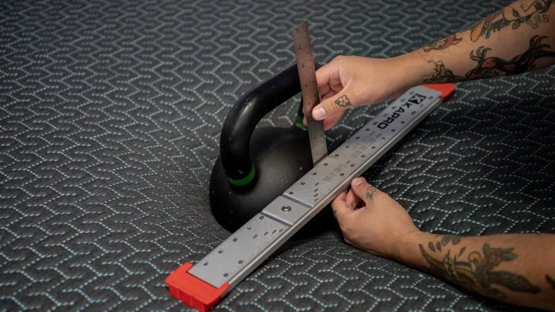 Kettlebell sinkage test on the Tuft & Needle Mint Hybrid Mattress