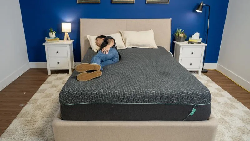 Our tester side sleeping on the Tuft & Needle Mint Hybrid Mattress