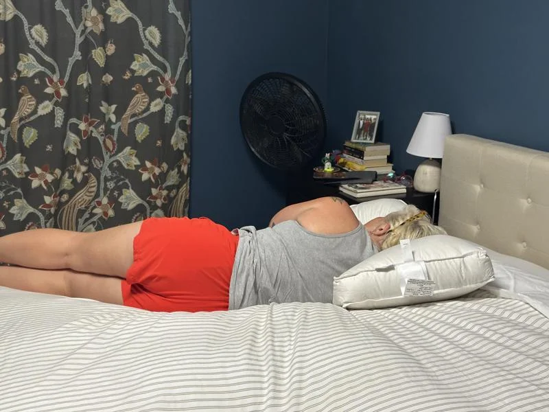 Our sleep expert Sosha Lewis using the Parachute Home Down Side Sleeper Pillow