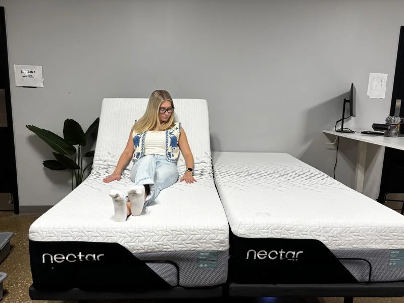 Our tester gets a feel for the Nectar Premier Adjustable Base with split king mattresses