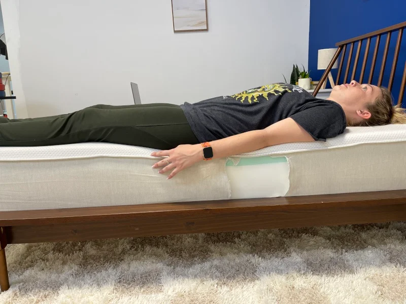 Our tester does a full-body edge support test on a Boring Hybrid Mattress.