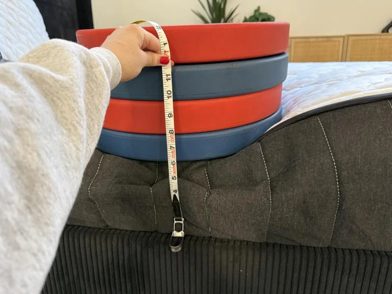 Measuring the deflection of weight plates on the edge of the Titan Plus Core Mattress