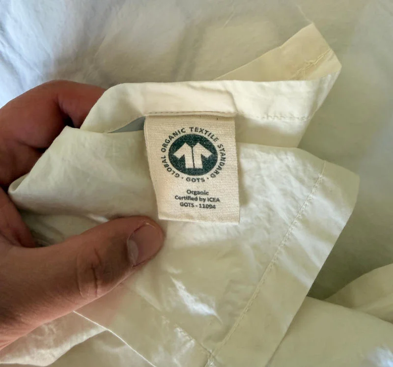 A close look at the organic certification tags on Quince Percale Sheets