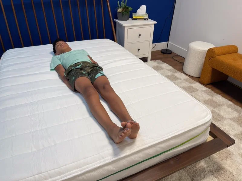 Our tester back-sleeping on the Helix Kids 8-Inch Mattress