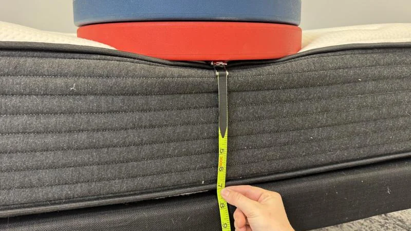 Measuring the deflection of weight plates along the edge of the Plank Firm Mattress