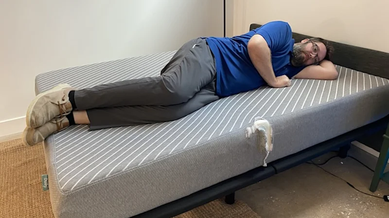 Our heavyweight tester lying on the Leesa Original mattress.