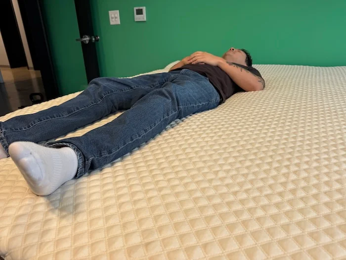 Our tester Kenny Timper on a Nolah Mattress Topper