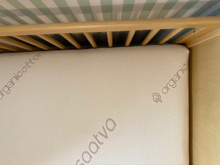 An overhead view of the Saatva Crib Mattress in a crib.