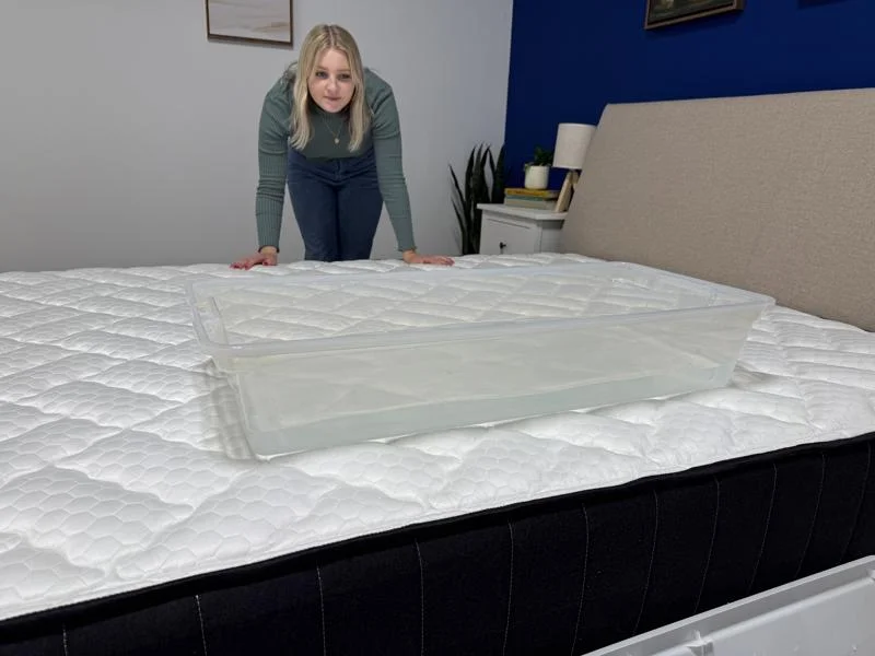 Our tester performs a ripple test on the Titan Plus Core Mattress