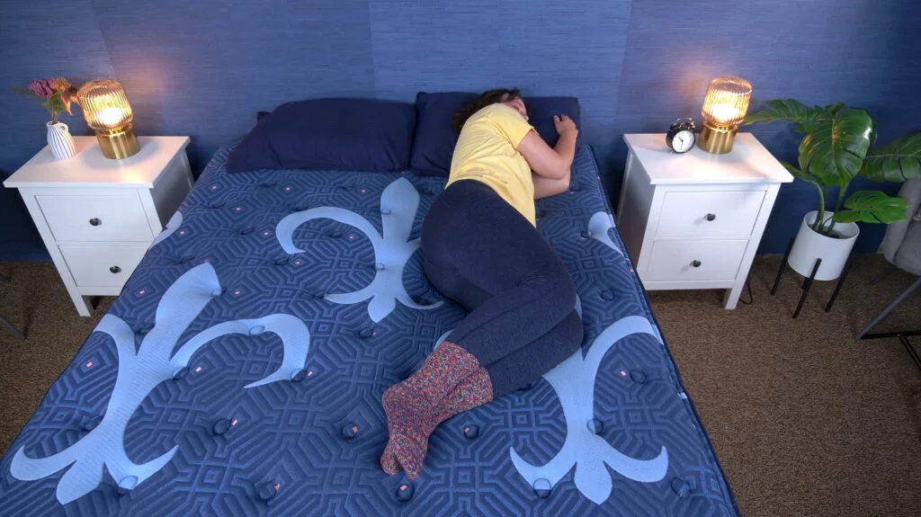 Amelia doing the Rest Test on the Stearns & Foster Lux Estate.