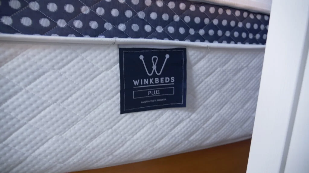 A close look at the logo on a The WinkBed Plus mattress.