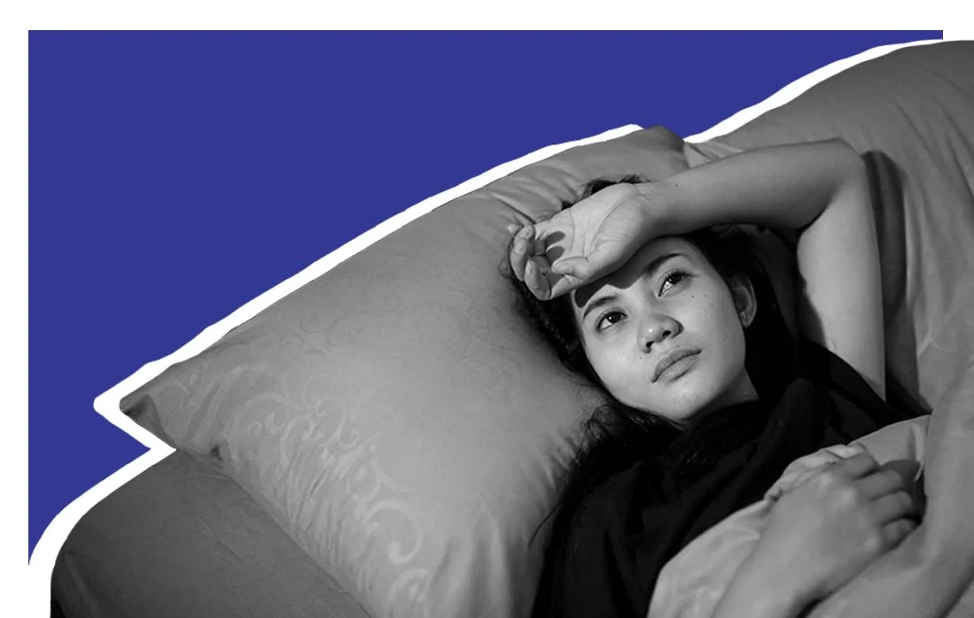 Person laying awake in bed min