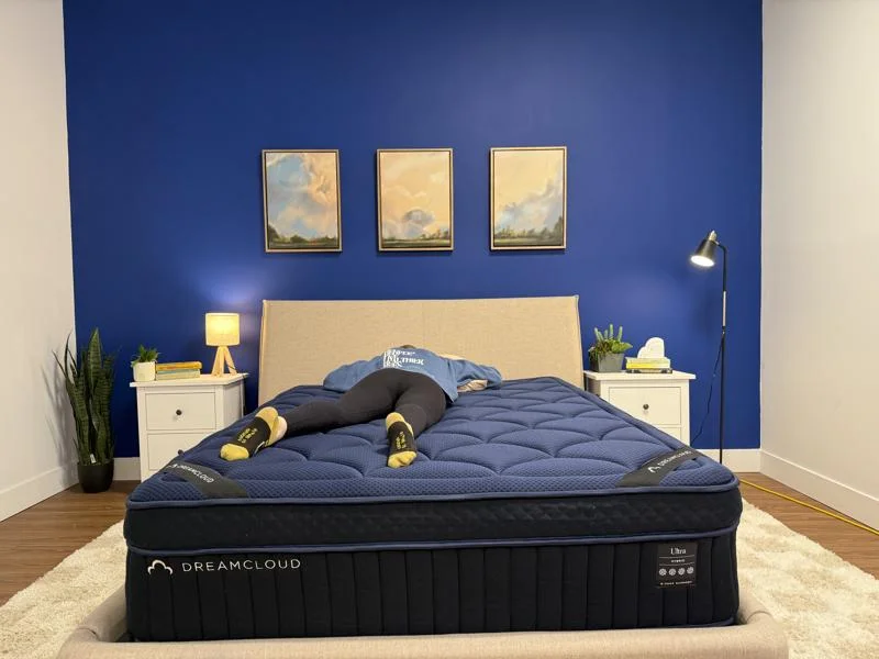 Our tester stomach sleeping on the DreamCloud Ultra Hybrid Mattress