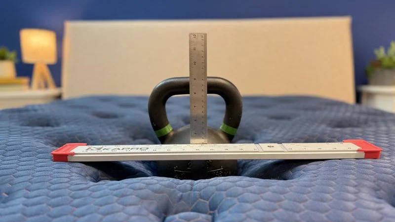 Kettlebell sinkage test on the Brooklyn Bedding Aurora Luxe