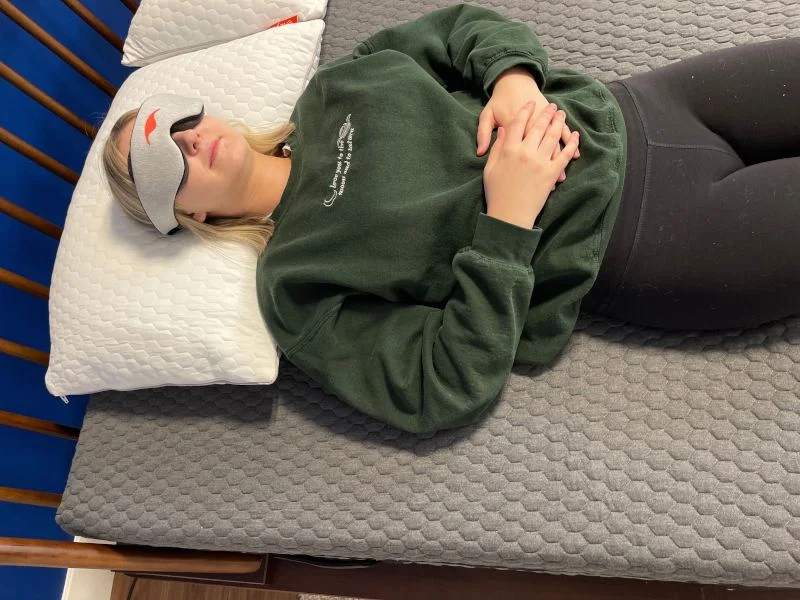 Our tester doing a partner test on a Layla Signature Hybrid Mattress