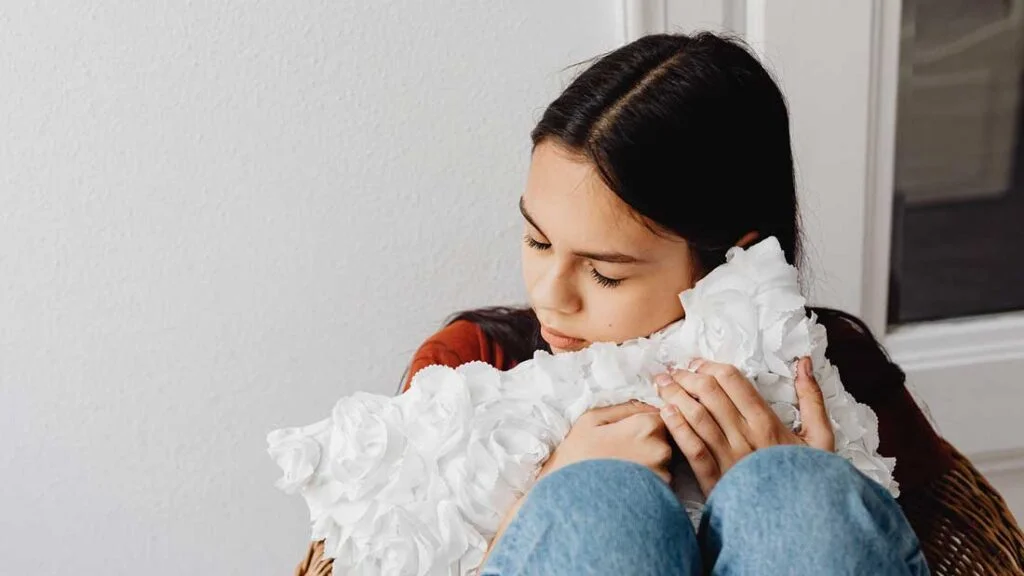 Woman holding a pillow