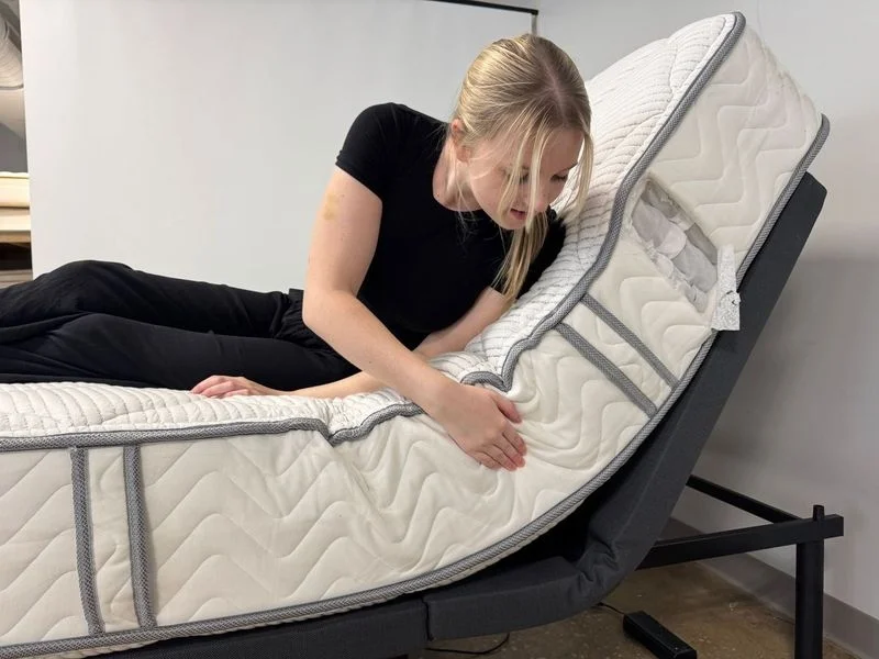 Checking the fit of a DLX Classic mattress on an adjustable base.