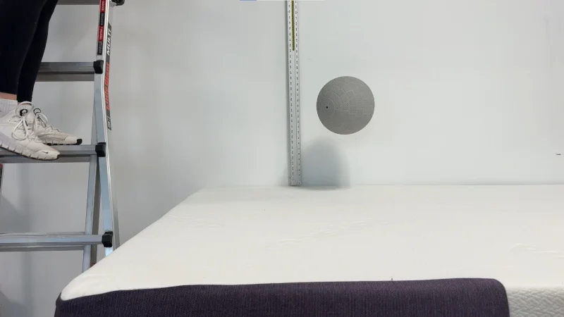 Our tester drops a ball for a bounce test on the Big Fig Classic Mattress