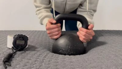 Our tester doing a response test on a Layla Signature Hybrid Mattress