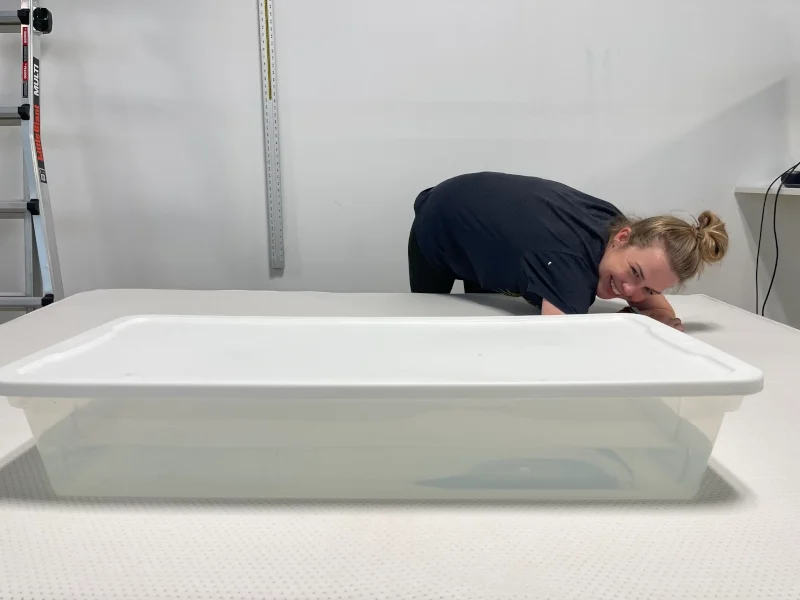 Our tester performs a ripple test on a Boring Hybrid Mattress