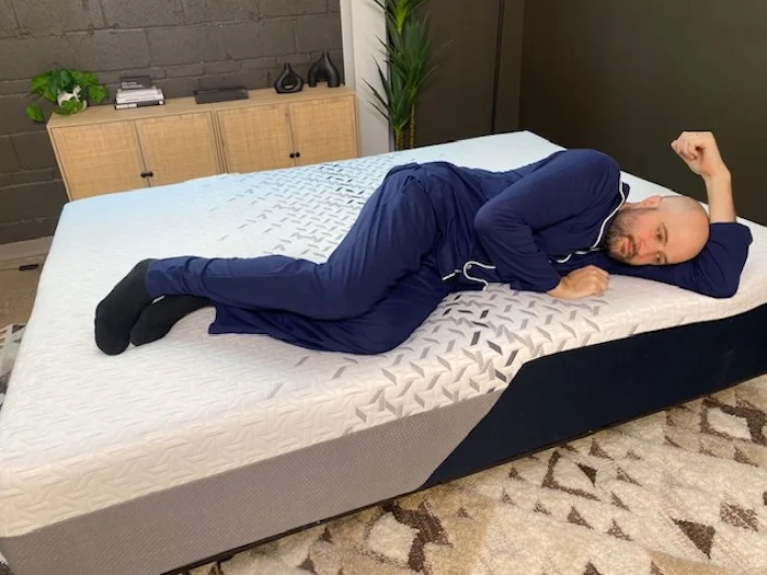 A man lying on his side on the Nectar Luxe Memory Foam.