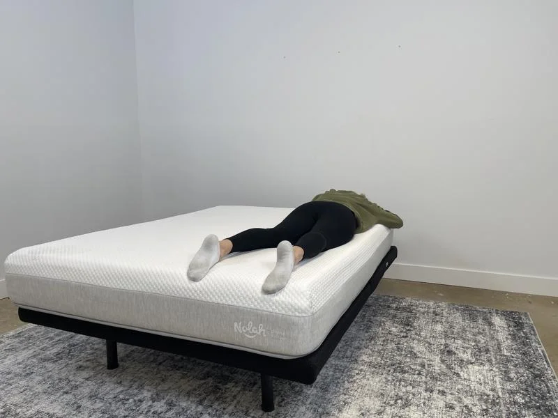 Our tester stomach-sleeping on the Nolah Original AF Mattress