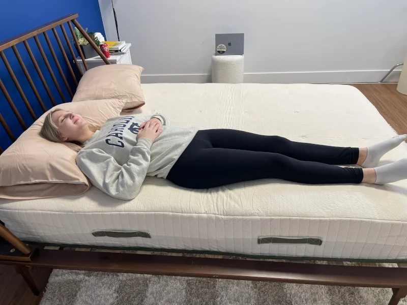 Our tester back-sleeping on an Avocado Eco Organic Mattress.