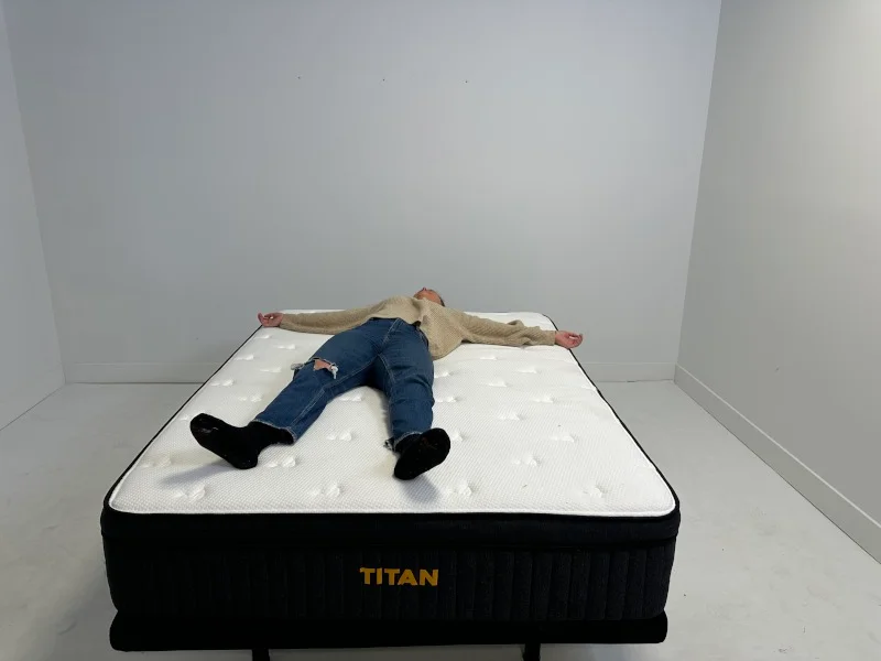 Our tester back-sleeping on a Titan Plus Luxe mattress