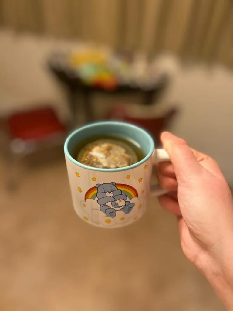 Our tester holds a cup of Republic of Tea Get Some Zzz's