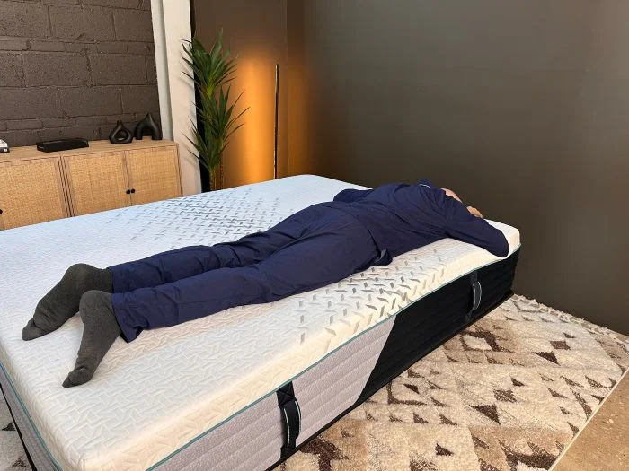 A man lies on his stomach on the Nectar Premier mattress