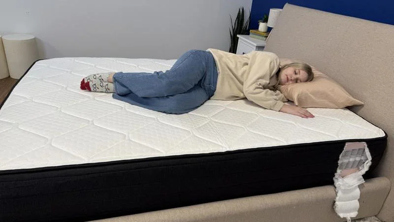 Our tester side sleeping on the Brooklyn Bedding Plank Firm Luxe Mattress