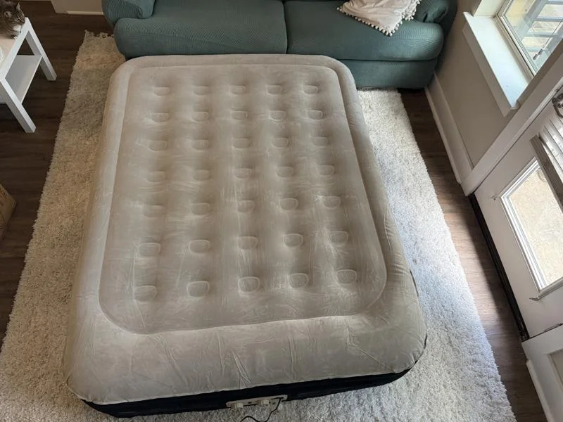 A fully-inflated King Koil Luxury Plush Pillow Top Air Mattress