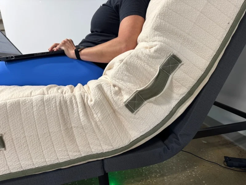 The Avocado Eco Organic Mattress on a platform bed