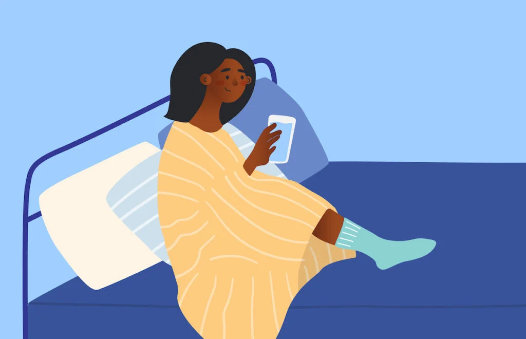 woman drinking water in bed