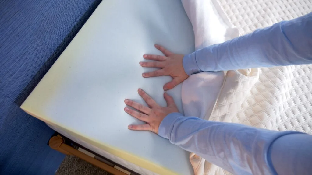 Our product tester performs a response test on the Nolah Mattress Topper