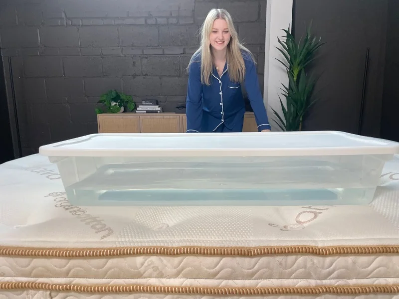 Riley Otis performs a ripple test on the Saatva Latex Hybrid.