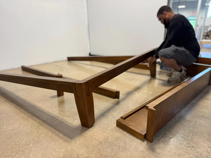Our tester assembling the Thuma Classic Bed.