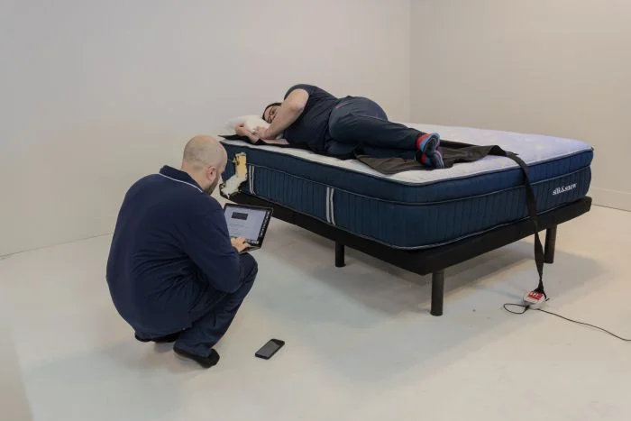 Our testers using a high-tech mat to render pressure maps