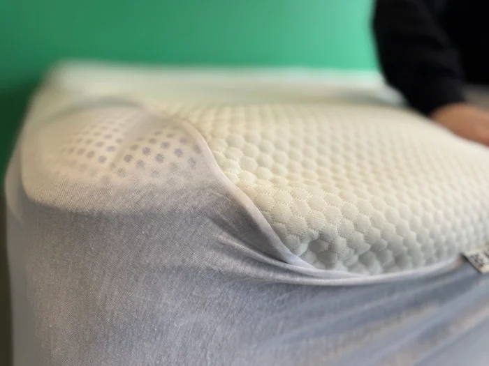 A closeup of a mattress corner covered by the Bear Mattress Protector.