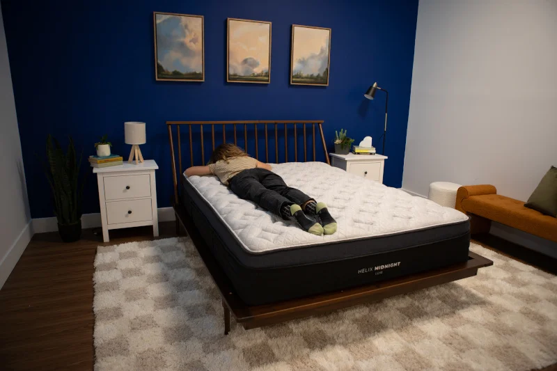 Our tester stomach-sleeping on a Helix Midnight Luxe Mattress