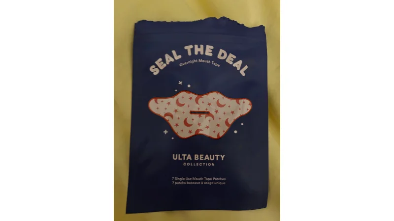 An opened pouch of mouth tape patches