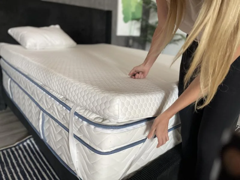 Our product tester uses the corner strap on a Helix GlacioTex Premium Topper