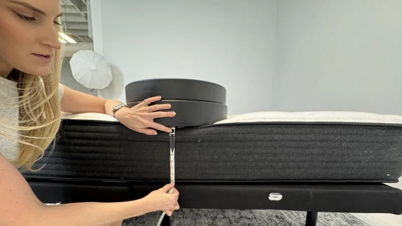 Measuring the deflection of weight plates along the edge of the Plank Firm Mattress