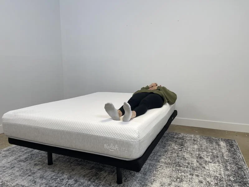 Our tester back-sleeping on the Nolah Original AF Mattress