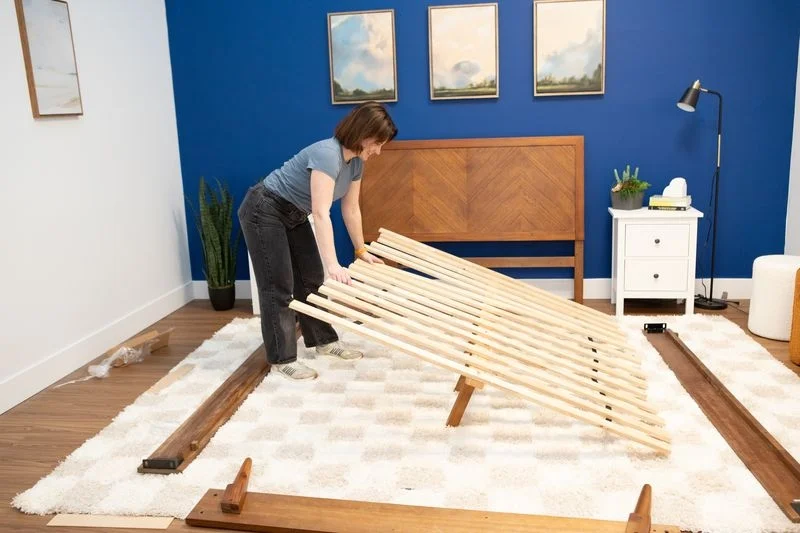 Our tester Nicole Davis puts together a Bear Summit bed frame.
