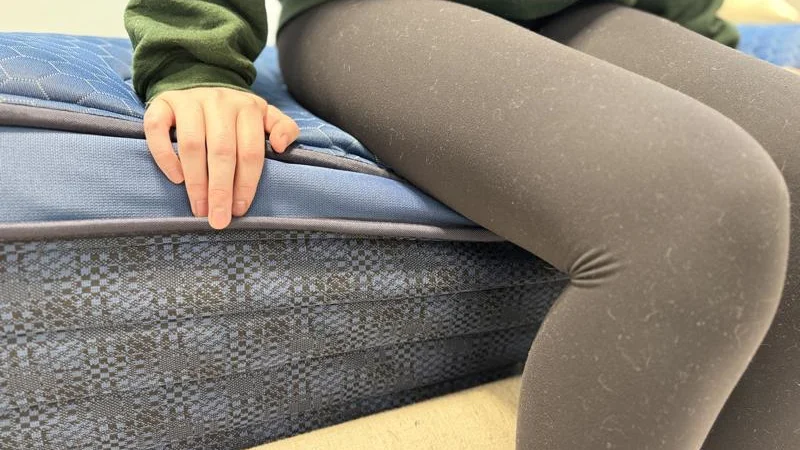 Seated edge support test on the Brooklyn Bedding Signature Hybrid Mattress