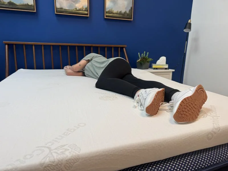 Our product tester side-sleeping on a Brooklyn Bedding 3-Inch Latex Topper